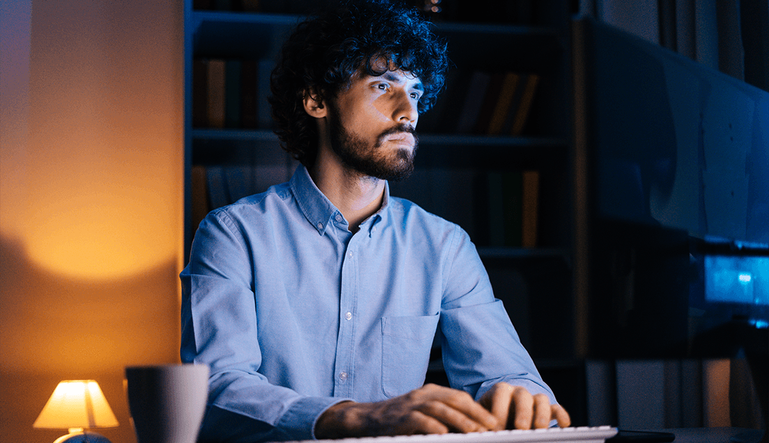 Man typing on computer